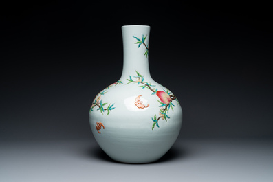 A Chinese famille rose relief-molded 'tianqiuping' vase with nine peaches, Qianlong mark, 19/20th C.