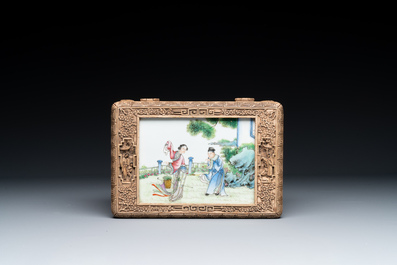 A Chinese Canton carved wooden casket with a famille rose plaque, Republic