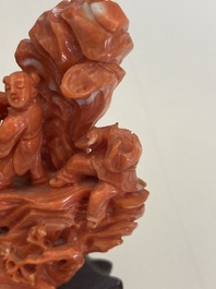 A Chinese red coral 'Eight Immortals' group on wooden stand, 19/20th C.