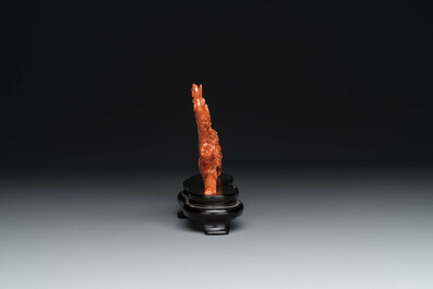 A Chinese red coral 'Eight Immortals' group on wooden stand, 19/20th C.