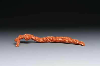 A Chinese red coral 'Eight Immortals' group on wooden stand, 19/20th C.