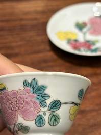 A pair of Chinese famille rose 'peony' cups and saucers, Yongzheng
