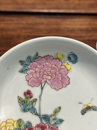 A pair of Chinese famille rose 'peony' cups and saucers, Yongzheng