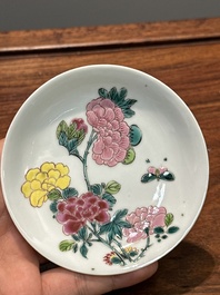 A pair of Chinese famille rose 'peony' cups and saucers, Yongzheng