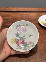 A pair of Chinese famille rose 'peony' cups and saucers, Yongzheng