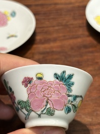 A pair of Chinese famille rose 'peony' cups and saucers, Yongzheng