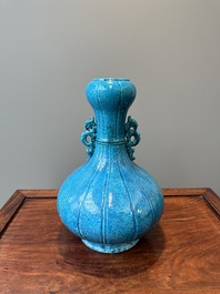 A Chinese monochrome powder-blue garlic-mouth vase with chilong handles, 18/19th C.