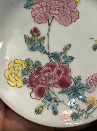 A pair of Chinese famille rose 'peony' cups and saucers, Yongzheng