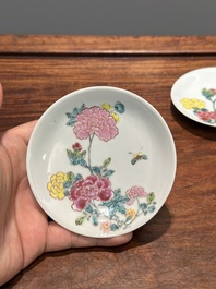 A pair of Chinese famille rose 'peony' cups and saucers, Yongzheng