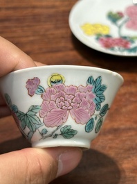 A pair of Chinese famille rose 'peony' cups and saucers, Yongzheng