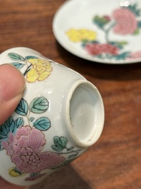 A pair of Chinese famille rose 'peony' cups and saucers, Yongzheng