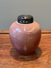 A Chinese monochrome copper-red-glazed ginger jar with a reticulated wooden cover, 18/19th C.