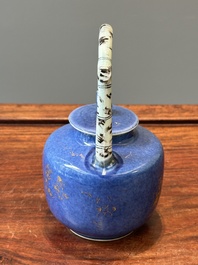 A Chinese gilt-decorated powder-blue teapot and cover with a faux-bamboo handle, Kangxi