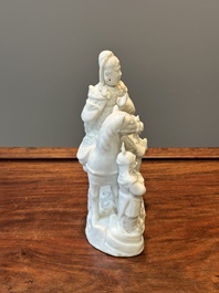 A Chinese Dehua blanc de Chine group of Guandi on horseback and two attendants, Kangxi
