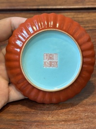 A Chinese coral-red-glazed gilt-decorated 'lotus scroll' saucer, Jiaqing mark, Republic