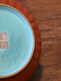 A Chinese coral-red-glazed gilt-decorated 'lotus scroll' saucer, Jiaqing mark, Republic