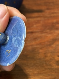 A Chinese gilt-decorated powder-blue teapot and cover with a faux-bamboo handle, Kangxi