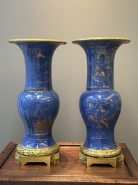 A pair of Chinese gilt-decorated powder-blue 'yenyen' vases with gilt bronze mounts, Kangxi
