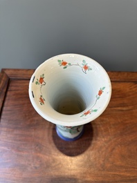 A Chinese famille verte powder-blue-ground 'court lady' beaker vase, Kangxi