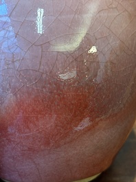 A Chinese monochrome copper-red-glazed ginger jar with a reticulated wooden cover, 18/19th C.