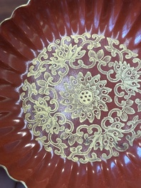 A Chinese coral-red-glazed gilt-decorated 'lotus scroll' saucer, Jiaqing mark, Republic