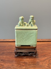 A Chinese Longquan celadon rectangular censer and cover on wooden stand, Ming