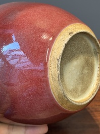 A Chinese monochrome copper-red-glazed ginger jar with a reticulated wooden cover, 18/19th C.