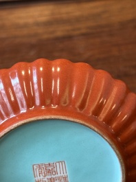 A Chinese coral-red-glazed gilt-decorated 'lotus scroll' saucer, Jiaqing mark, Republic
