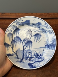 A Chinese blue and white plate with a breastfeeding woman and fishermen on boats, Chenghua mark, Kangxi