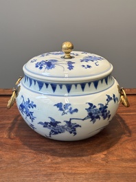 A Chinese blue and white covered bowl with floral design and gilt bronze mounts, Transitional period