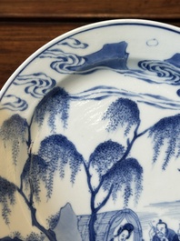 A Chinese blue and white plate with a breastfeeding woman and fishermen on boats, Chenghua mark, Kangxi