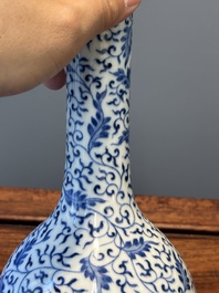 A Chinese blue and white 'lotus scroll' bottle vase, Yongzheng mark and possibly of the period