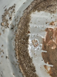 A large Chinese blue and white Swatow dish with a lobster and a carp at a fishing village, Ming