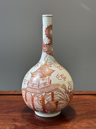 A Chinese iron-red-decorated and gilt 'dragon and carp' bottle vase, 19/20th C.