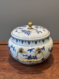 A Chinese blue and white covered bowl with floral design and gilt bronze mounts, Transitional period