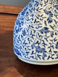 A Chinese blue and white 'lotus scroll' bottle vase, Yongzheng mark and possibly of the period