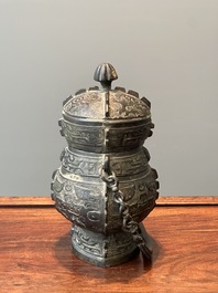 A Chinese bronze ritual wine vessel and cover, 'you', Yuan/Ming