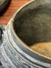 A Chinese bronze ritual wine vessel and cover, 'you', Yuan/Ming