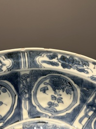 A large Chinese blue and white Swatow dish with a lobster and a carp at a fishing village, Ming