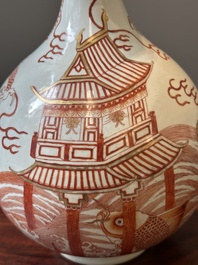 A Chinese iron-red-decorated and gilt 'dragon and carp' bottle vase, 19/20th C.