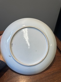 A Chinese famille verte caf&eacute;-au-lait ground plate and a monochrome white plate, Kangxi