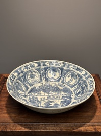 A large Chinese blue and white Swatow dish with a lobster and a carp at a fishing village, Ming