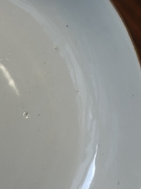 A Chinese famille verte caf&eacute;-au-lait ground plate and a monochrome white plate, Kangxi