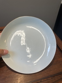 A Chinese famille verte caf&eacute;-au-lait ground plate and a monochrome white plate, Kangxi