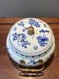 A Chinese blue and white covered bowl with floral design and gilt bronze mounts, Transitional period