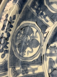 A large Chinese blue and white Swatow dish with a lobster and a carp at a fishing village, Ming