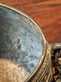 A Chinese bronze ritual wine vessel and cover, 'you', Yuan/Ming