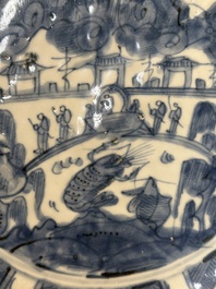 A large Chinese blue and white Swatow dish with a lobster and a carp at a fishing village, Ming