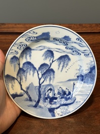 A Chinese blue and white plate with a breastfeeding woman and fishermen on boats, Chenghua mark, Kangxi