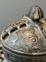 A Chinese bronze ritual wine vessel and cover, 'you', Yuan/Ming